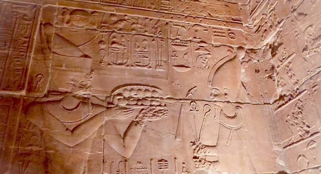 Egyptologist guide at Philae Temple reliefs